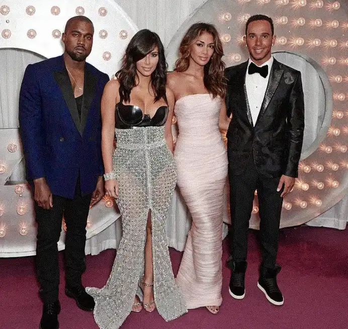 A Wild Night Out: Bianca Censori Goes Completely Braless in a Jaw-Dropping Sheer Getup and a Furry Headpiece on an Intimate Date Night with Kanye West MODISTA Archival photo from 2014 featuring Lewis Hamilton Nicole Scherzinger Kim Kardashian and Kanye West posing together.